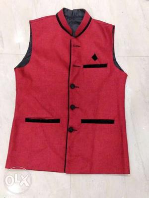 Red color Nehru jacket.