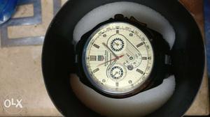 Round White Chronograph Watch With Black Strap