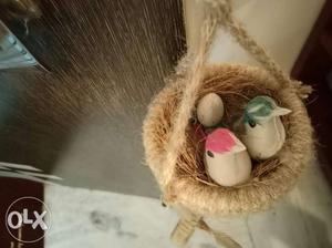 Two different designs of bird nest wall hangings