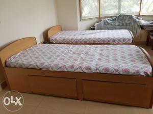 Two wooden beds in good condition with storage