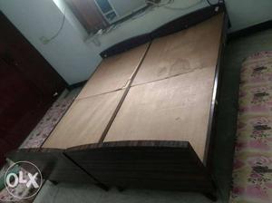 2 singleTeak wood frame cots with plywood boards
