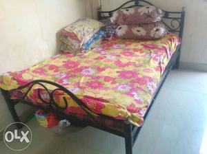 Brand new queen size iron bed. 1 year old gently used