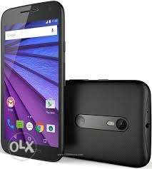 Moto G3 with charger & cover. The phone looks