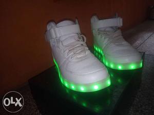 Pair Of White Mid-cut Sneakers With Green LED Sole And Box