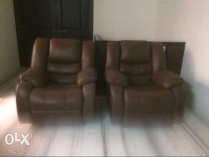 Two Brown Leather Recliner Armchairs