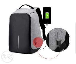Black And Gray Backpack With Battery Charger Cable