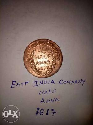 Gold-colored Indian Half Anna Coin