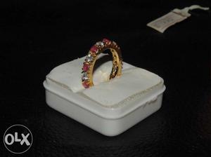 Gold-colored Red Gemstone Encrusted Ring