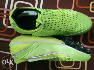 Pair Of Green-and-white Cleats