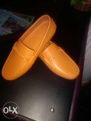 Pair Of Orange Slip-on Shoes