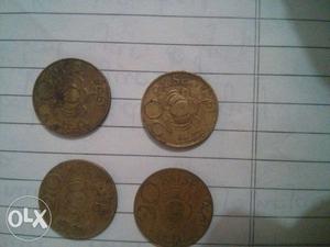 Round Gold-colored 20 Paise Coins
