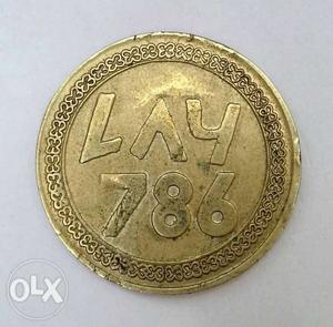 Round Gold-colored Lay 786 Coin