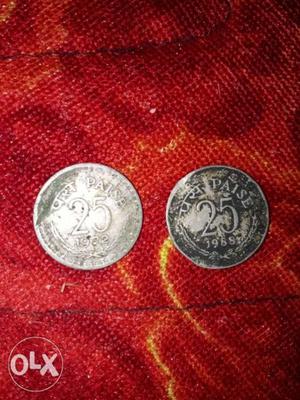 Two  Silver-colored 25 Indian Paise Coins
