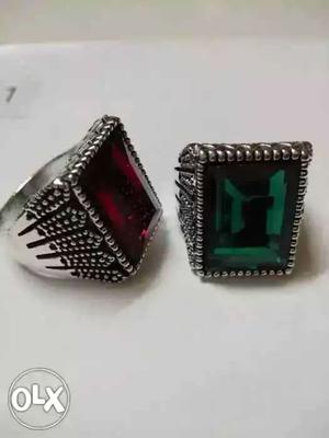 Two Silver-colored Red And Green Gemstone Rings