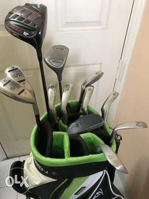 Gray Metal Golf Club Lot And Black And Green Golf Bag
