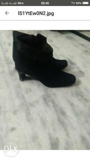 Pair Of Black Suede Heeled Boots