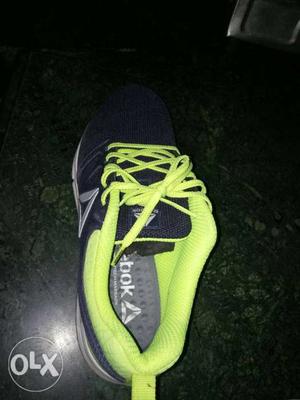 Paired Black And Green Reebok Running Shoe