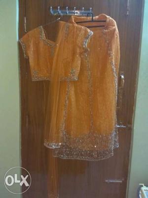 Party wear Orange Colour Lehenga Choli... Benaras