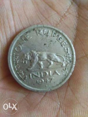 Rear 1 rupess silver coin  loin