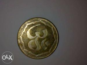 Round Gold-colored Ohm Coin