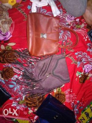 Women's brown and purple bags