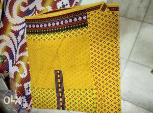 Yellow top material red colour bottom dupatta
