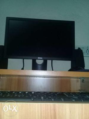 Black flat dell monitor with keyboard, mouse,speaker,and