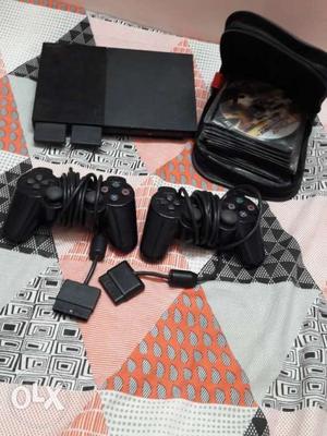 Ps2 With 25+ Cd's 2 controllers and 2 memory