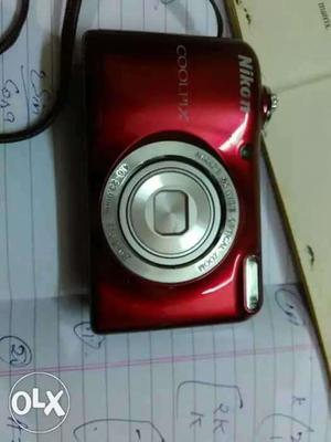 Red Nikon Coolpix Point-and-shoot Camera