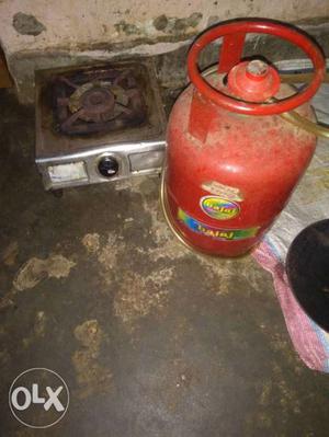 Red gas cylinder Tank And Gray Single Burner Gas Stove