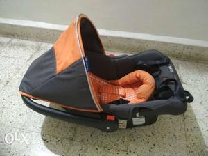 Baby's Black And Orange Car Seat Carrier