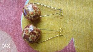 Pair Of Brown-and-silver-colored Earrings