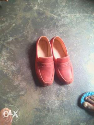 Pair Of Red Leather Slip-on Shoes