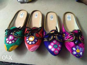 Three Pairs Of Multicolored Shoes