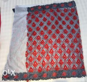 White, Red, And Gray Textile
