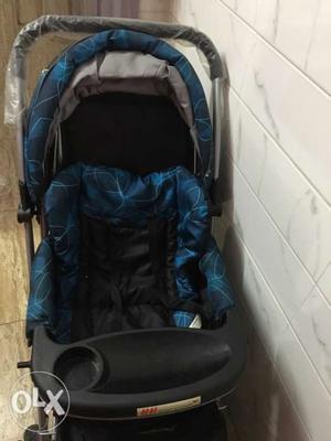 Baby stroller pram (black and blue).