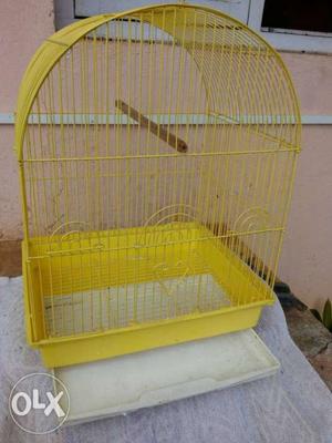 Bird cage with removable tray for easy cleaning.