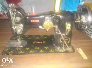 Black And Gold-colored Sewing Machine