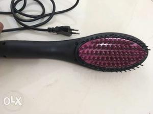 Brand new hair iron. Easy to use ad a brush.