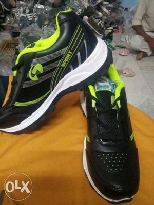 Pair Of Black-and-green Skechers Shoes