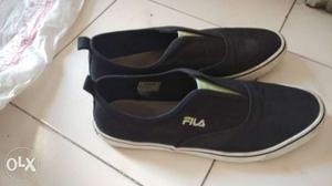 Pair Of Black fila Low-top Sneakers