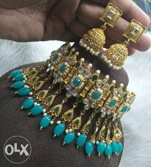 Pair Of Gold-colored Jhumka Earrings And Blue Beaded