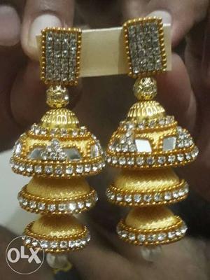 Pair Of Gold-colored Jhumka Earrings With Clear Gemstones