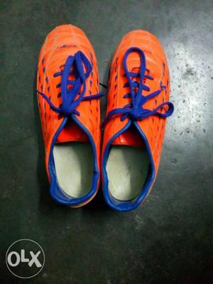 Pair Of Orange-and-blue Adidas Cleats
