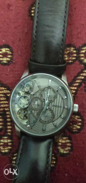Round Silver-colored Skeleton Watch With Black Strap