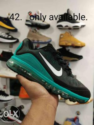 Teal And Black Nike Low-top Sneaker With Text Overlay