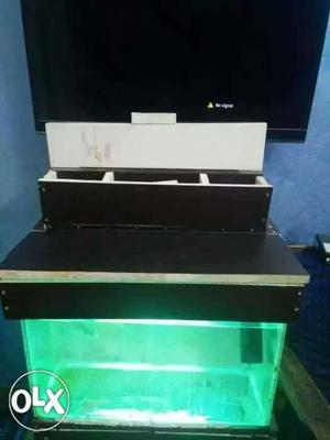 This is a 2 feet aquarium tank with handmade top with LED