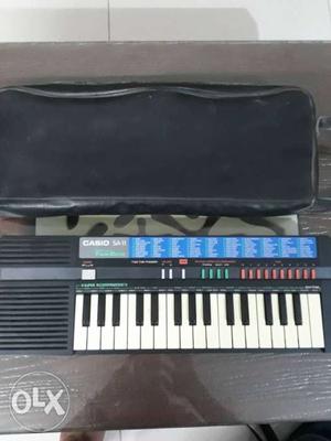 Black Casio Electronic Keyboard And Black Bag