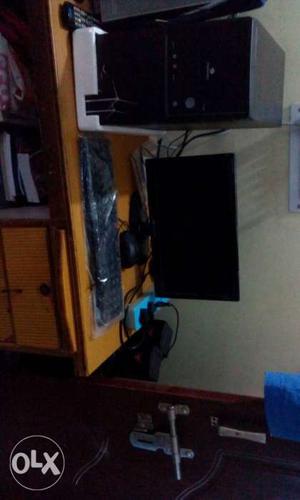Flat Screen Monitor, Black Computer Tower, And Black