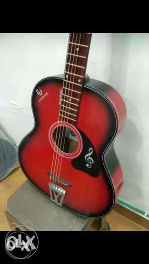 Red and black acoustic guitar 8..1, very
